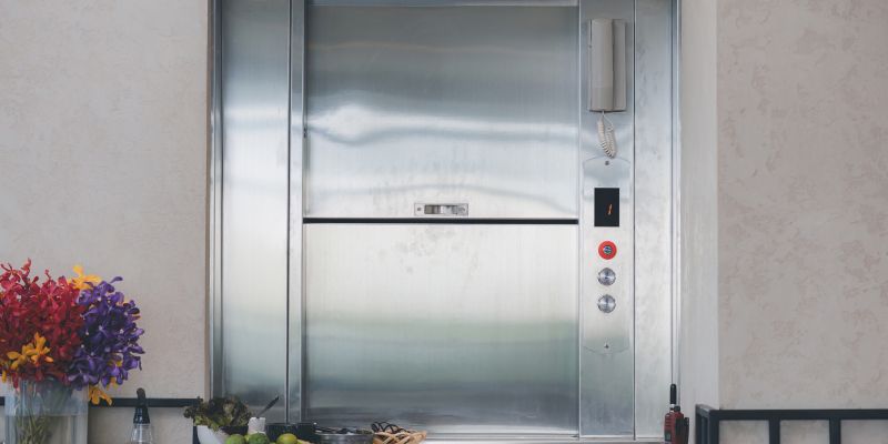Dumbwaiter Lift elevator in a kitchen of Restaurant or Hotel used for carrying food or goods. Food hoist and food elevator for ready meals. Small Freight Elevators or Dumbwaiters Food Elevators